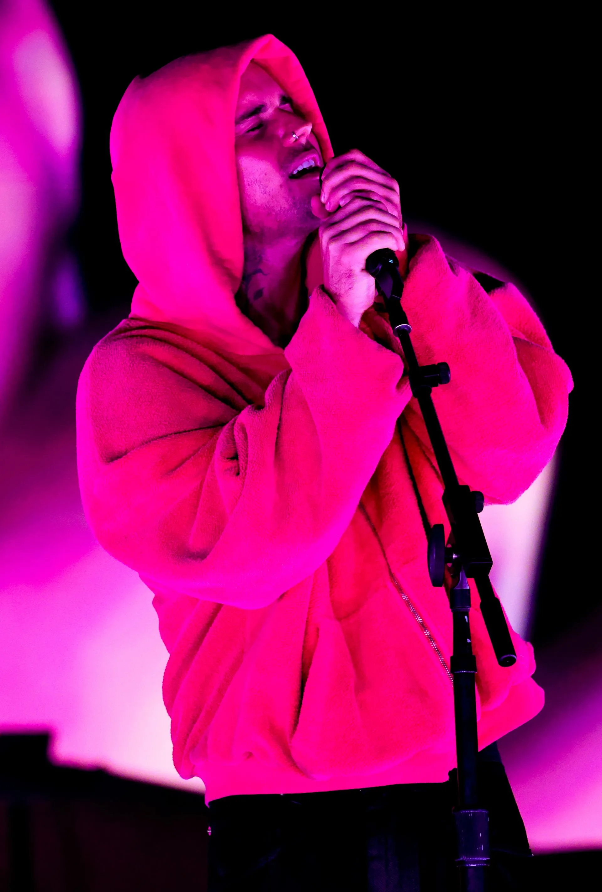 Image may contain Justin Bieber Electrical Device Microphone Performer Person Solo Performance Clothing and Hood