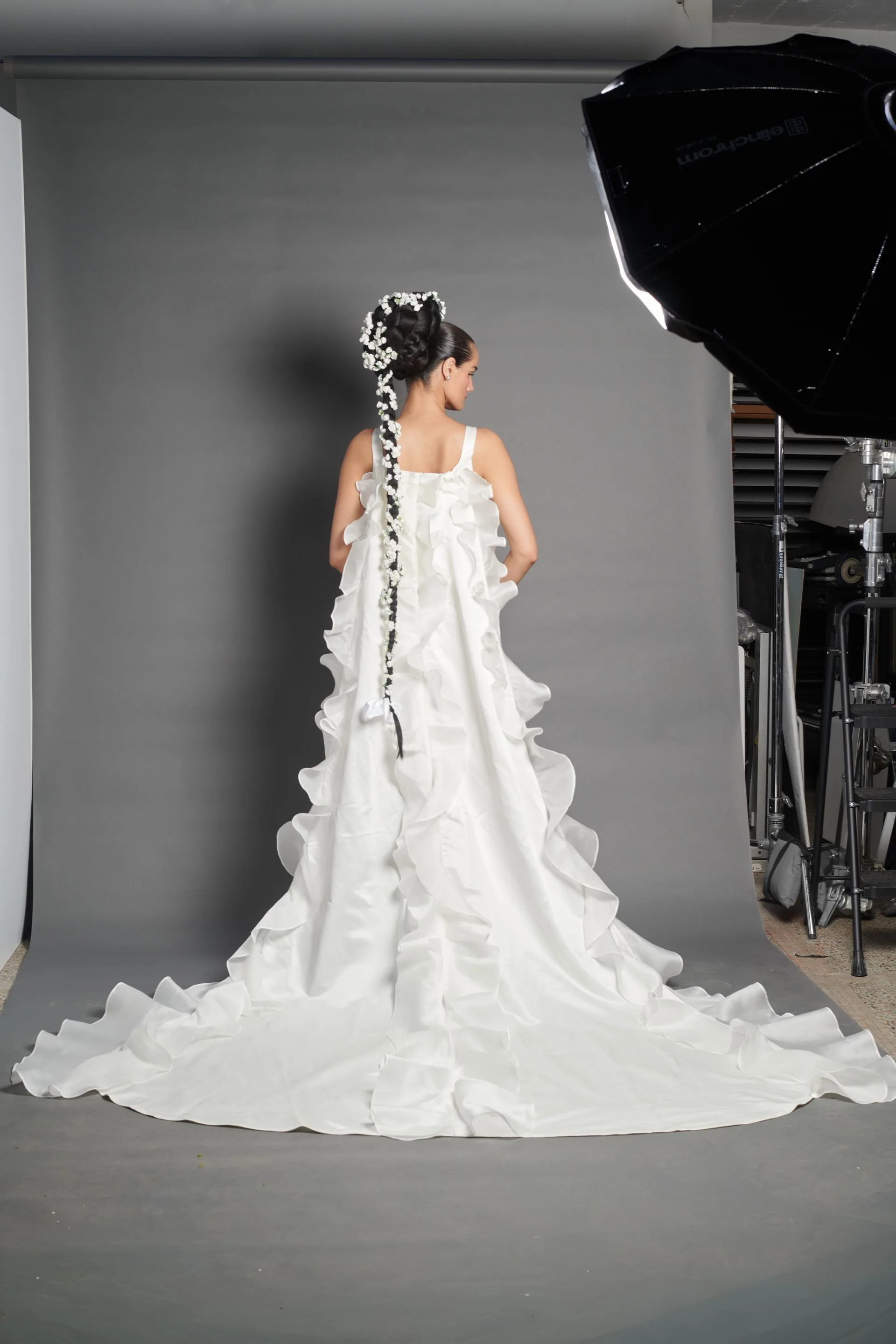 Image may contain Clothing Dress Fashion Formal Wear Gown Wedding Wedding Gown Adult and Person