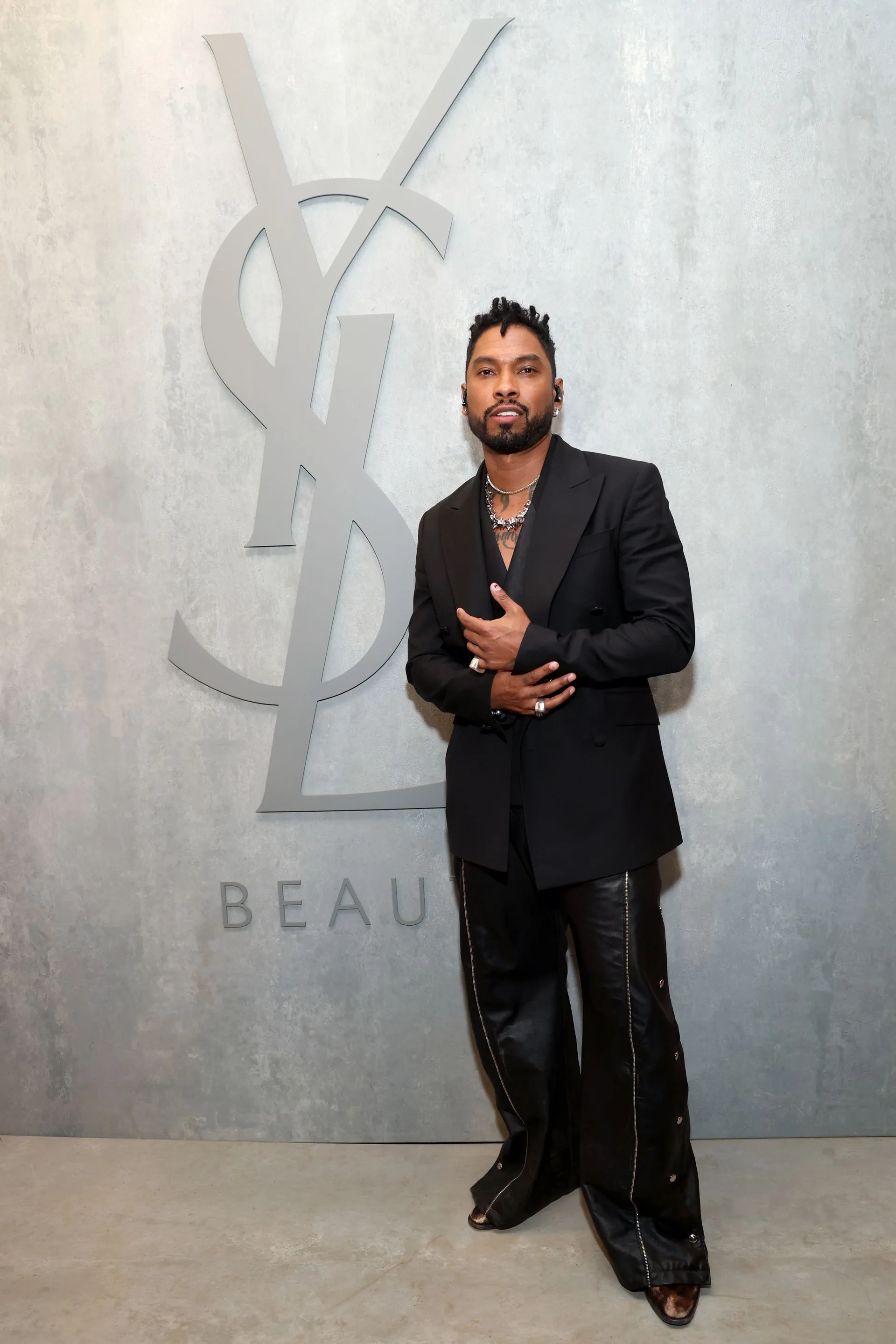 Image may contain Miguel Blazer Clothing Coat Jacket Person Standing Adult Formal Wear and Suit