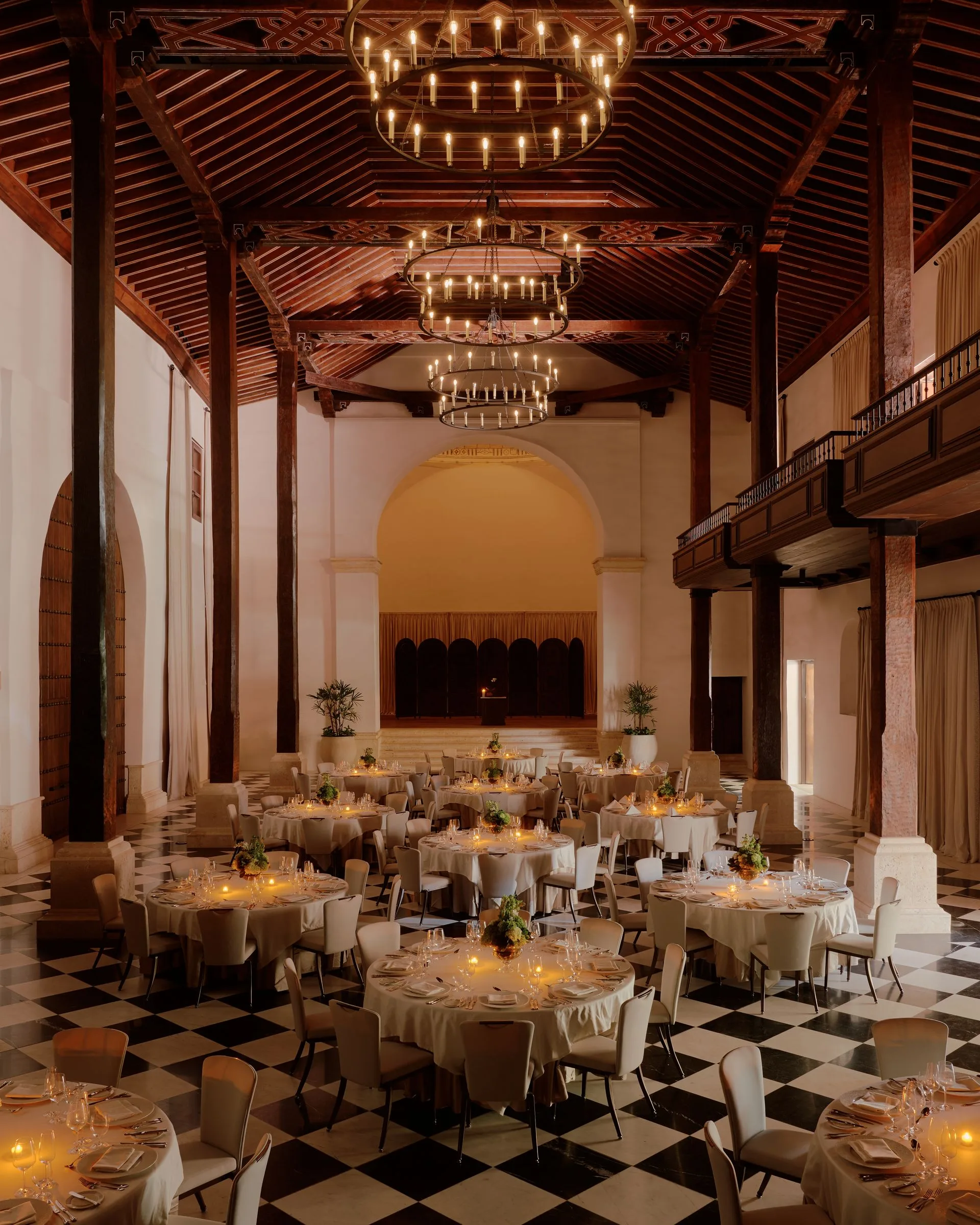 Image may contain Indoors Hall Fun Banquet Plant Chair Furniture Chandelier and Lamp