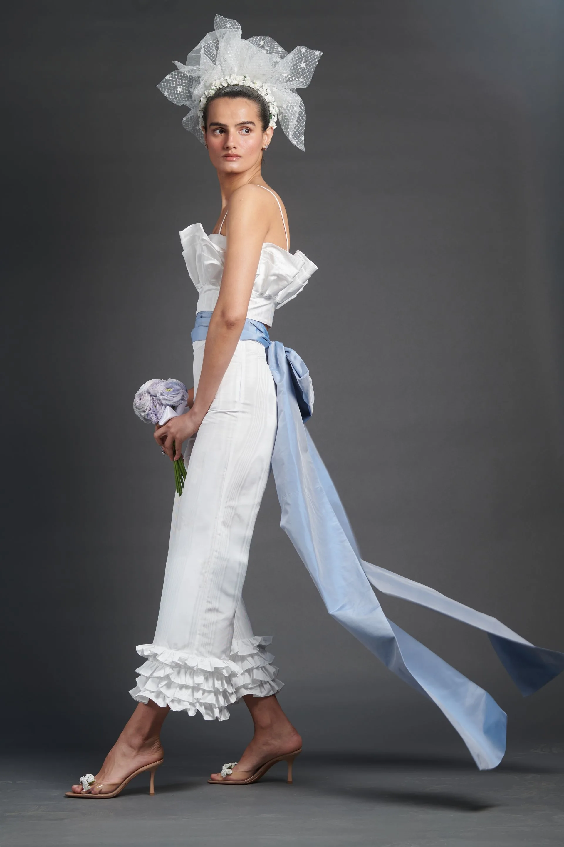 Image may contain Fereshteh Karimi Clothing Hat Bonnet Adult Person Wedding and Dress