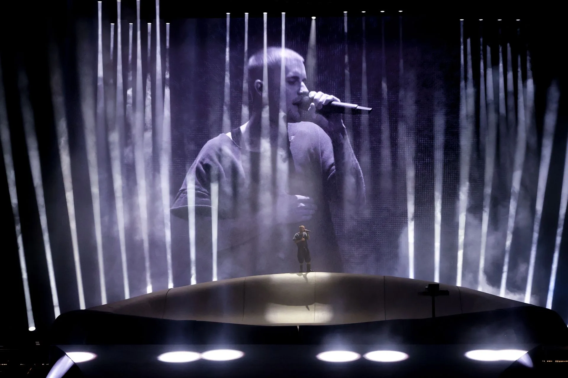 Image may contain Lighting Electrical Device Microphone Performer Person Solo Performance Adult Stage and Concert