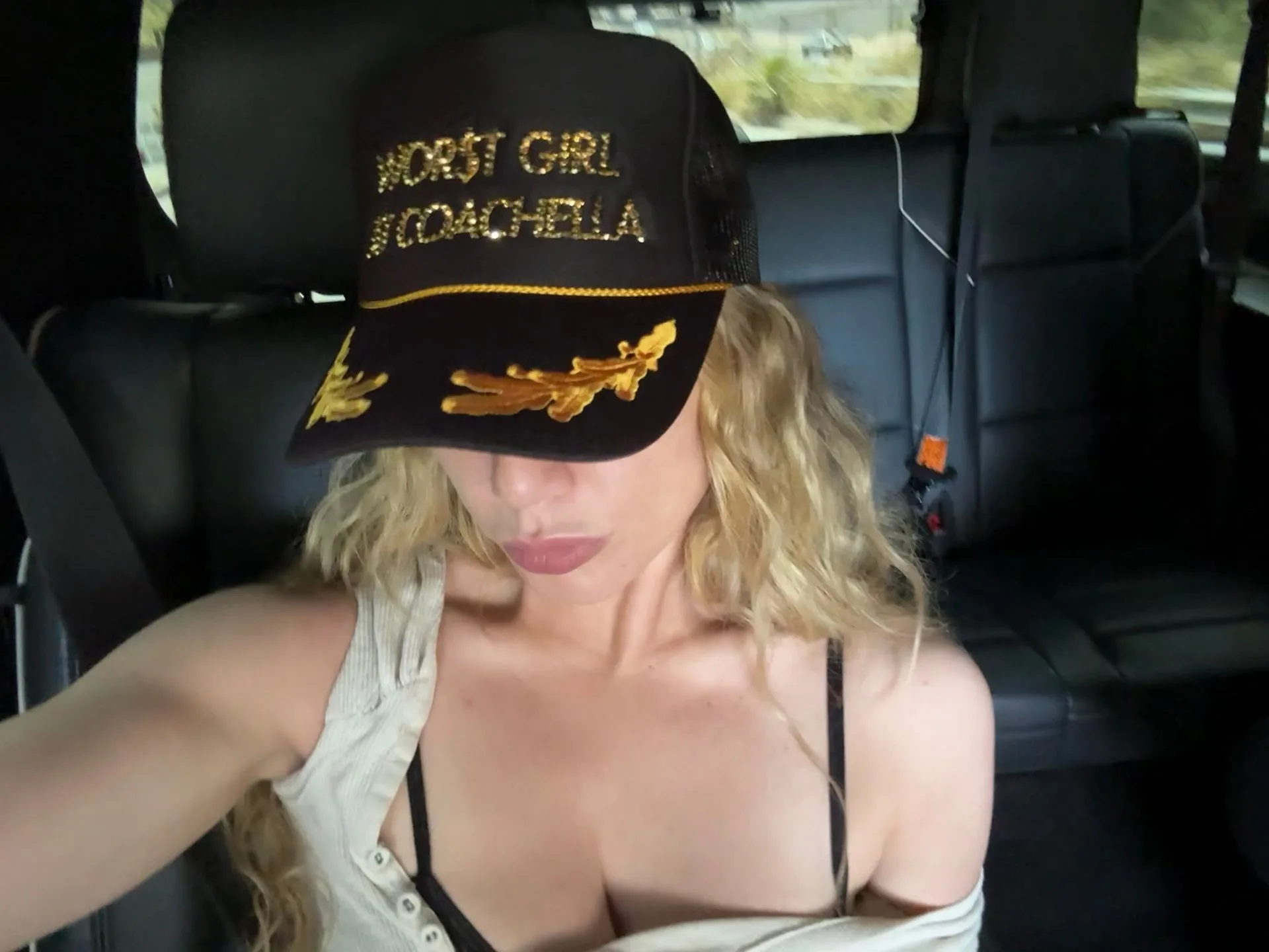 Image may contain Baseball Cap Cap Clothing Hat Face Head Person Photography Portrait Adult Blonde and Hair