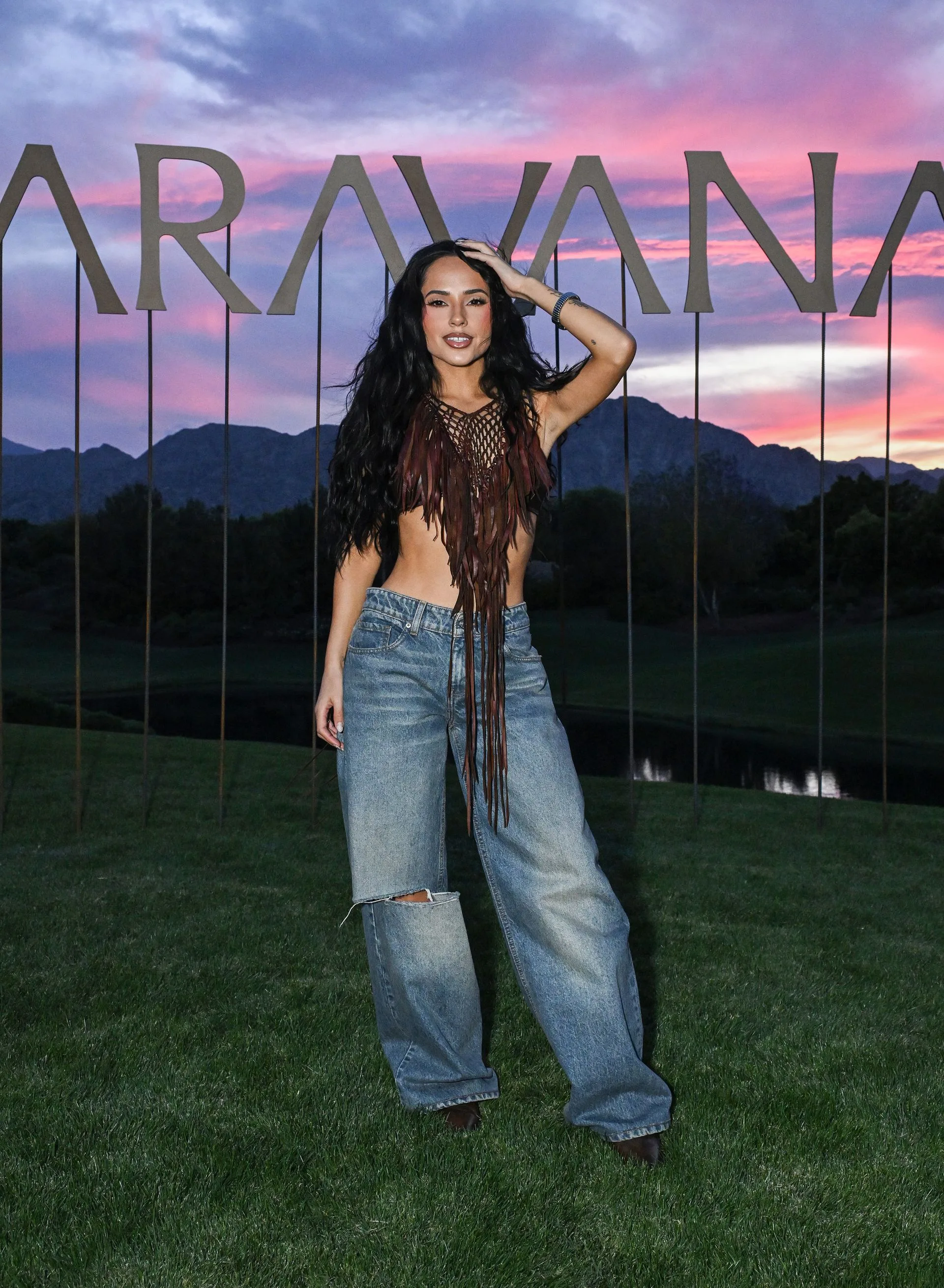 Image may contain Becky G Clothing Pants Jeans Person Teen Face Head Photography Portrait Grass and Plant